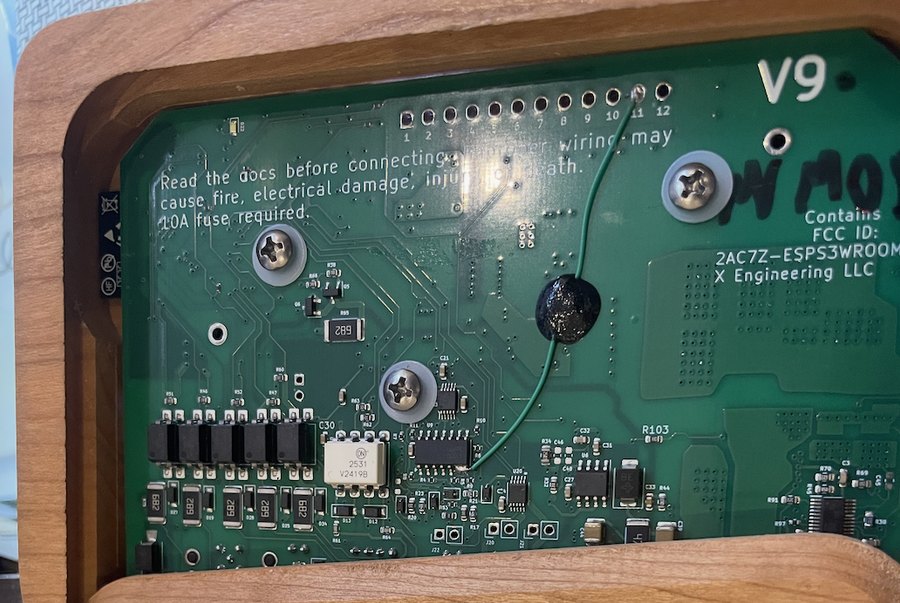 Board seated in the wood Base with all three screws and their plastic washers installed
